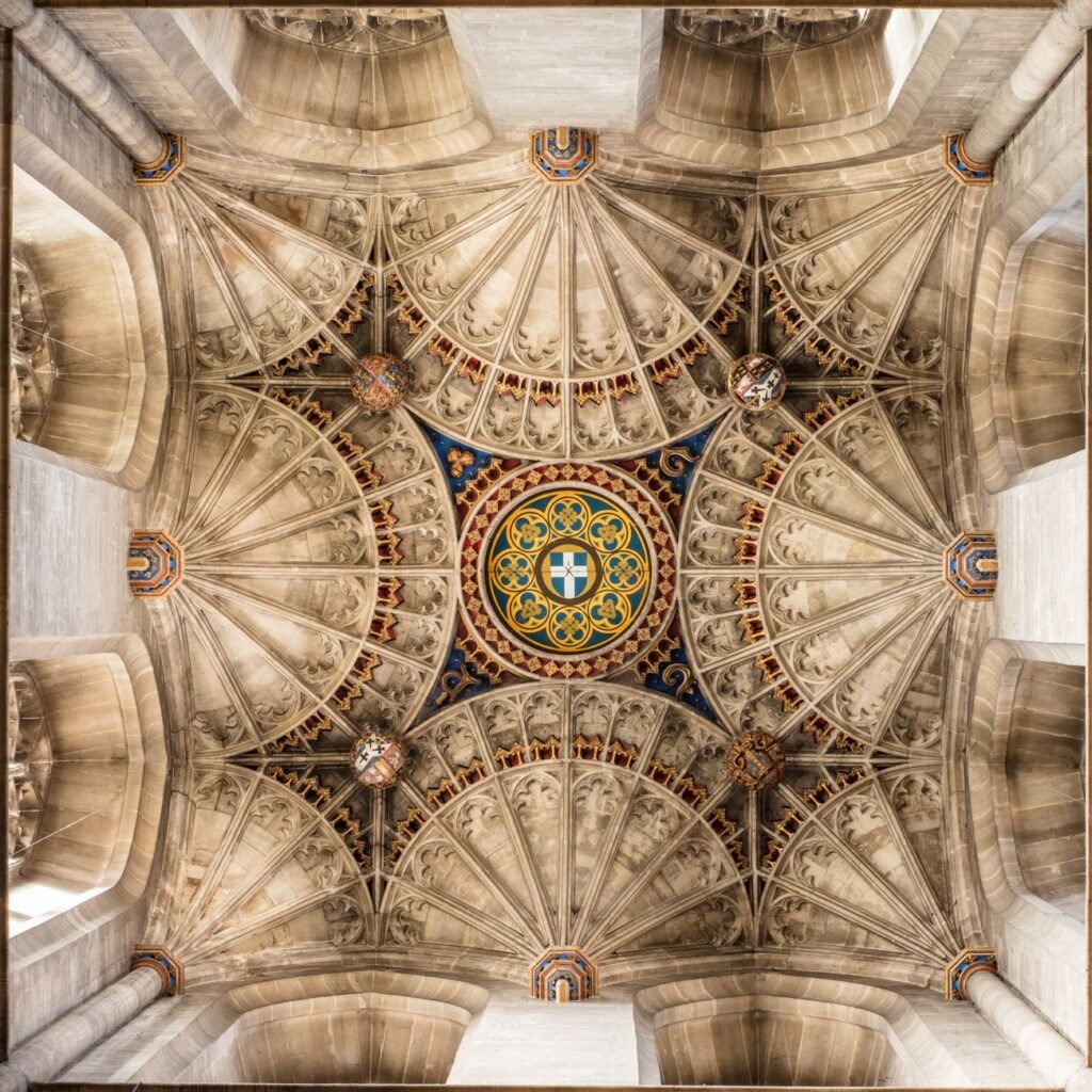 Detailed view of the ornate, symmetrical ceiling inside Canterbury Cathedral, England.