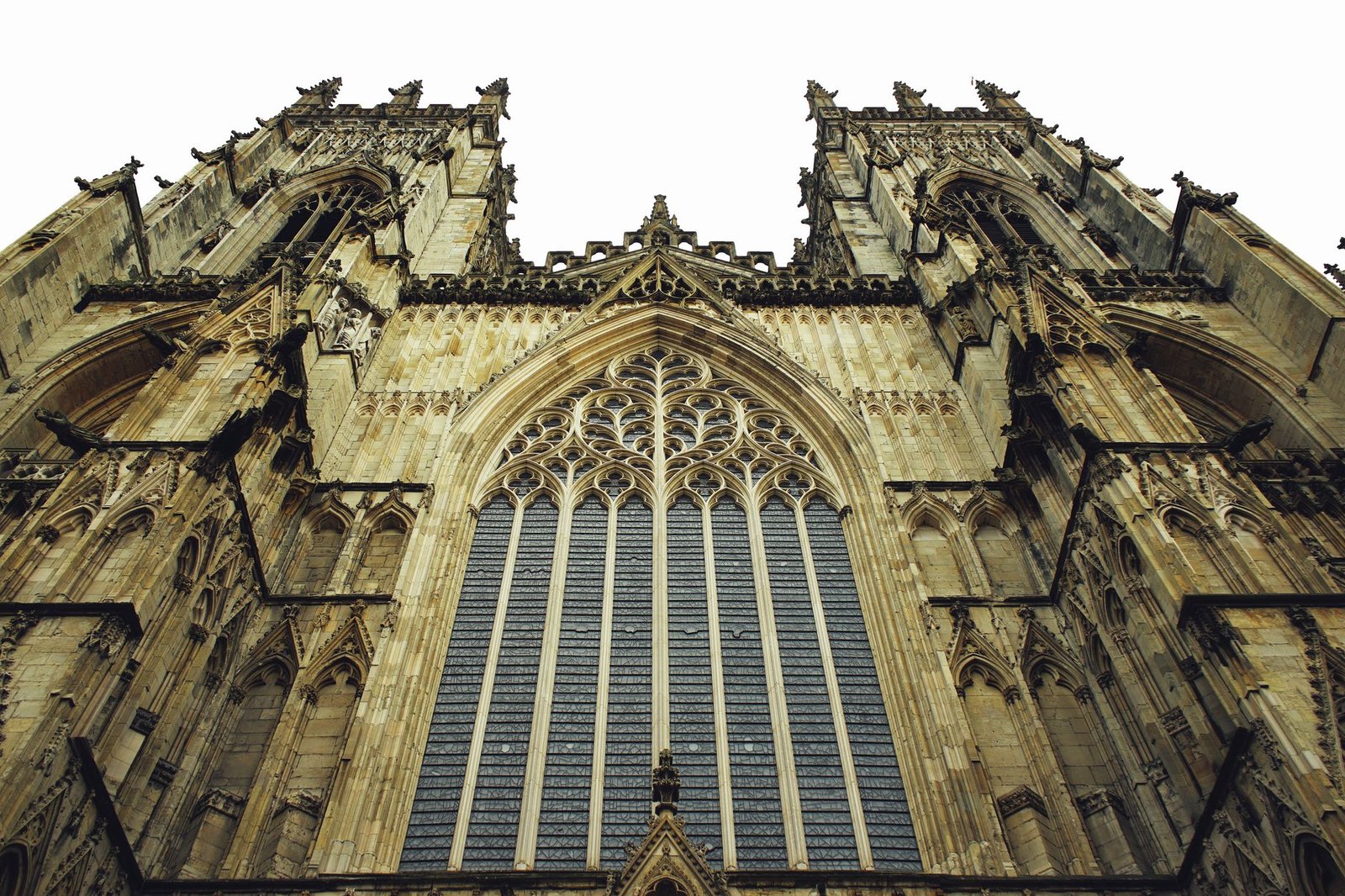 Low angle shot capturing the intricate Gothic architecture of York Minster in England.