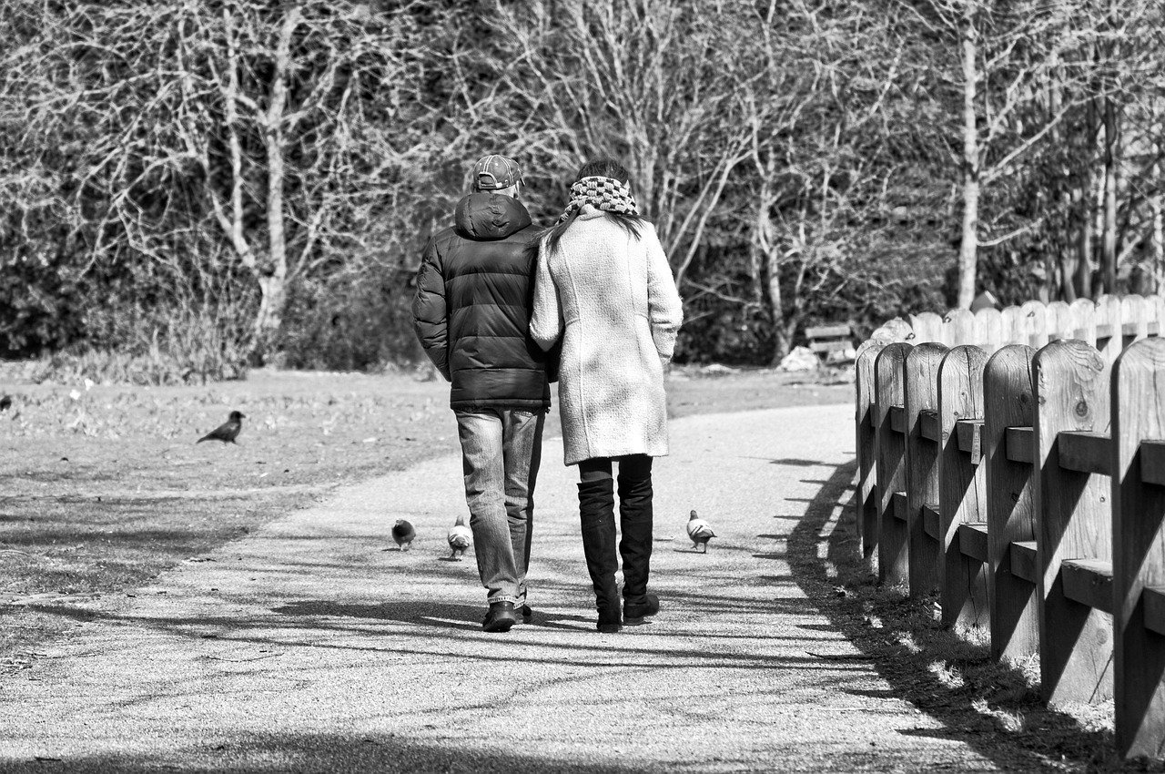 man, woman, person, people, two, couple, together, walking, arm in arm, footpath, park, gray walking, gray park, gray togethe