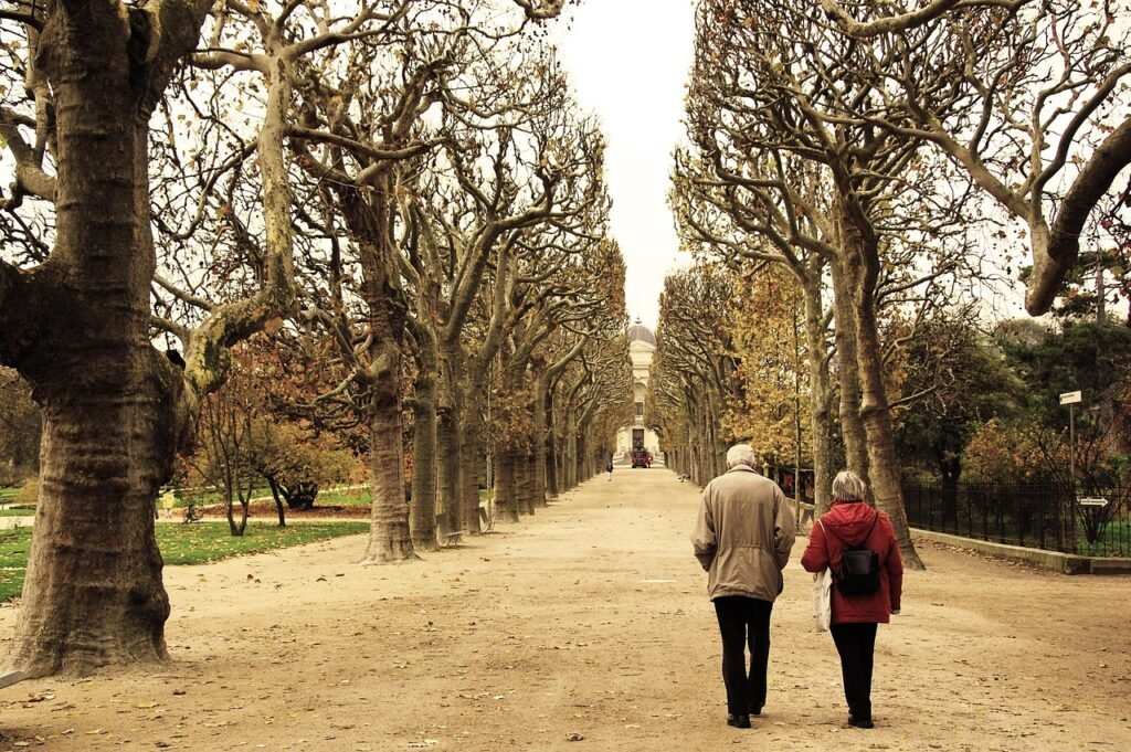 fall, couple, paris, france, outdoors, park, old couple, elderly couple, mature, autumn, walking, out for a walk, old couple,