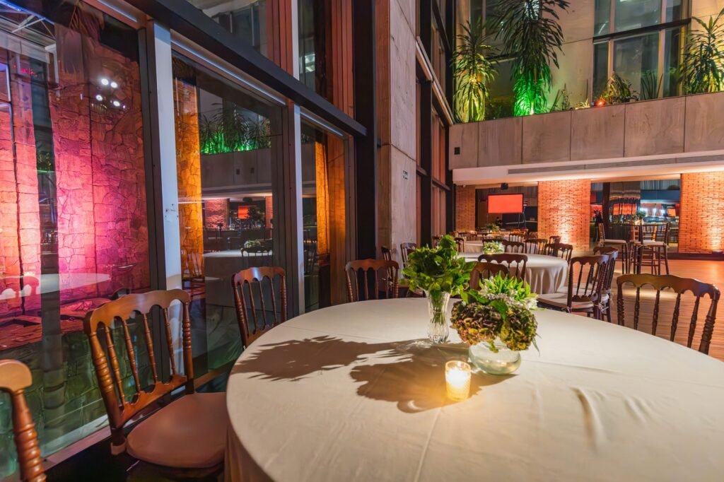 Luxurious restaurant scene featuring elegant tables, chairs, and ambient lighting.