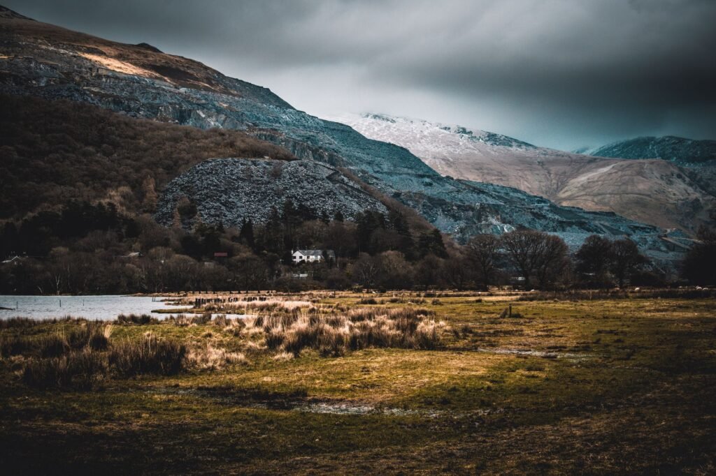 Breathtaking view of a mountainous landscape with moody skies and natural scenery.