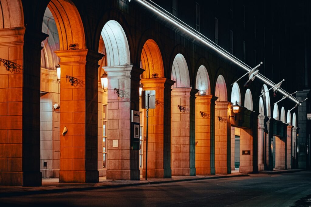 Beautifully lit building with arches and columns at night in Westminster, CO.