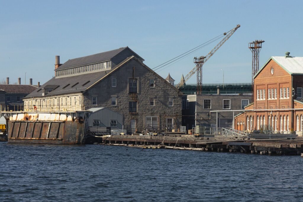 Explore the historic Boston Navy Yard with its iconic waterfront architecture and shipyard scenery.
