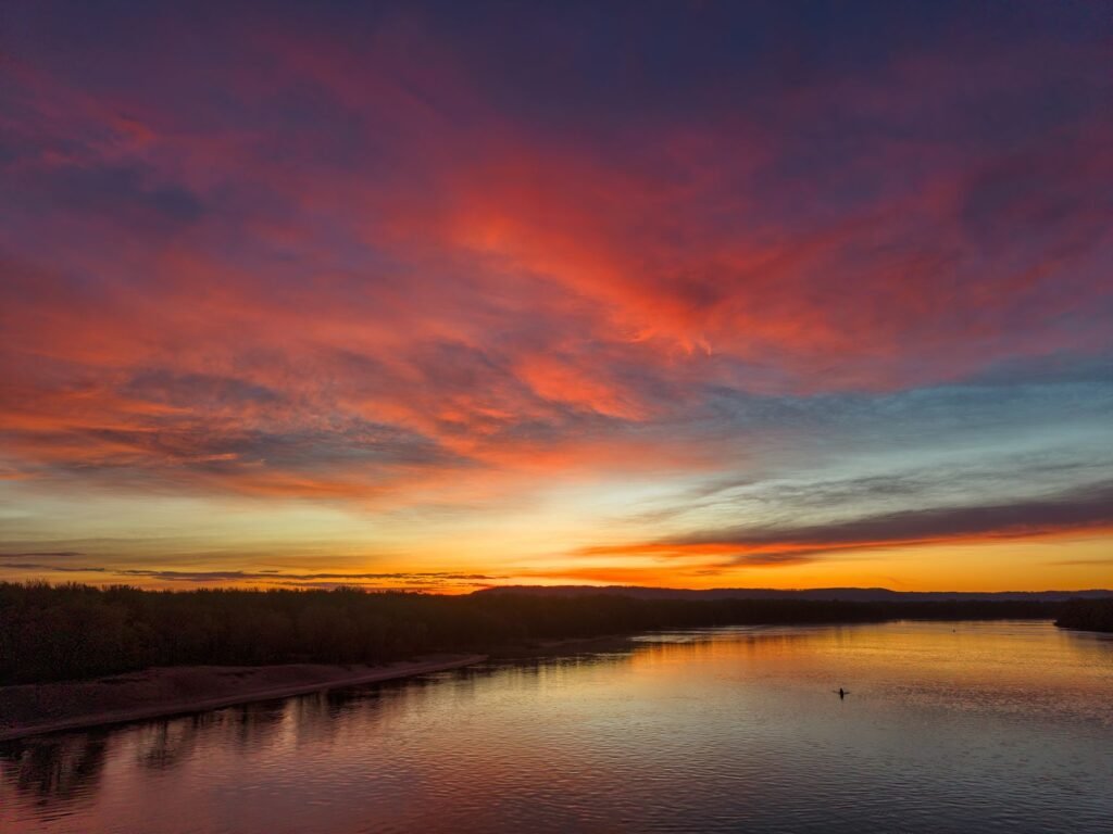 Breathtaking sunset over the Mississippi River at Reads Landing, capturing vivid colors and serene waters.
