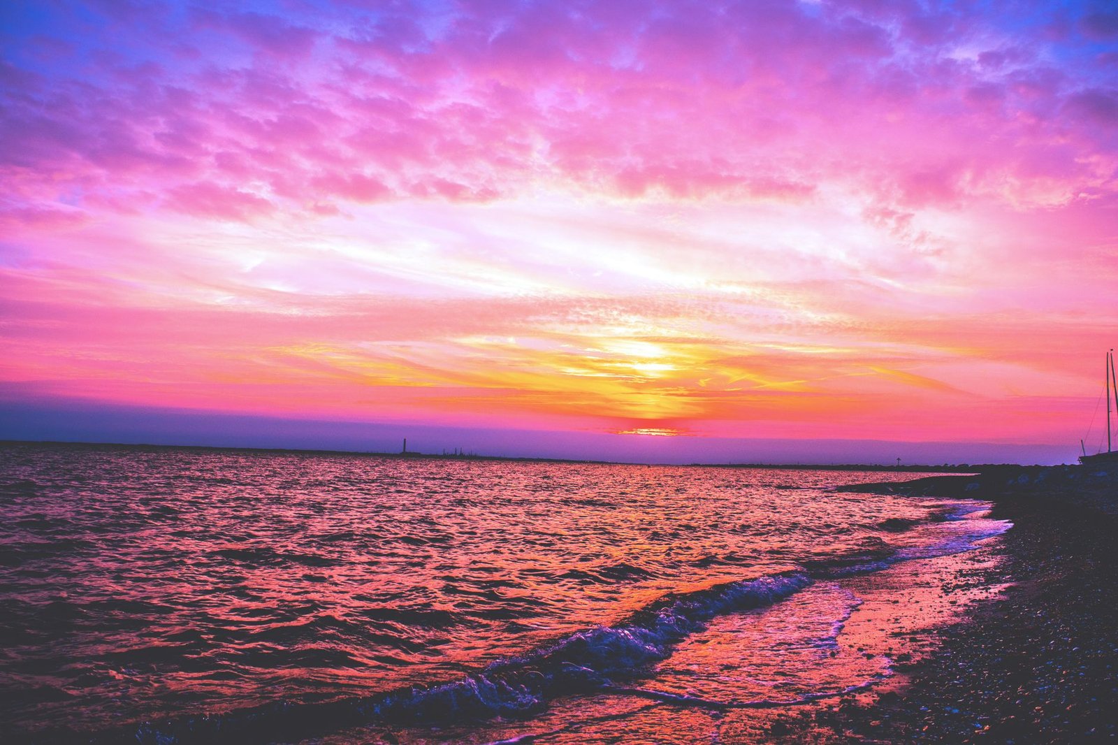 Stunning sunset at Dumfries and Galloway coast with vivid sky and serene sea.