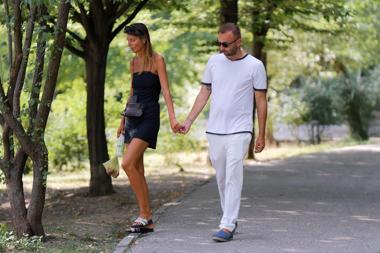 couple, walking, park, holding hands, together, outdoors, man and woman