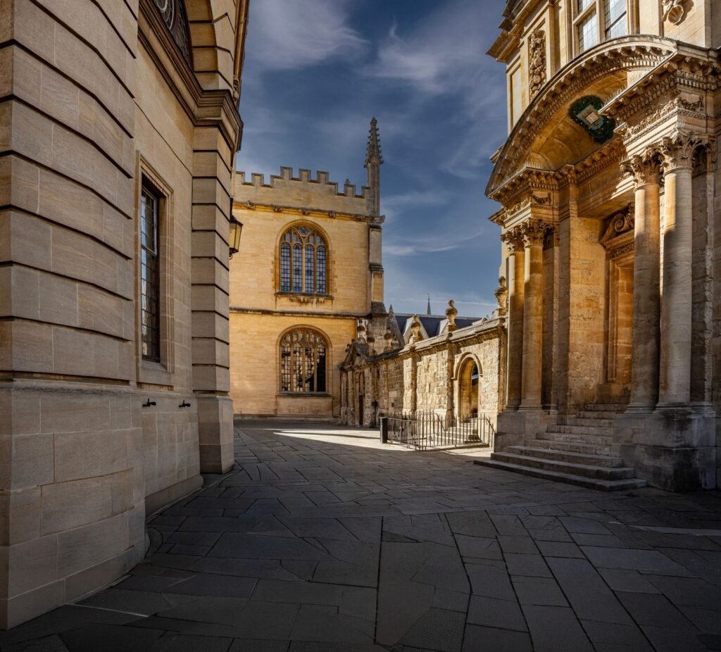 Elegant view of Oxford University's historic architecture with pristine blue skies.