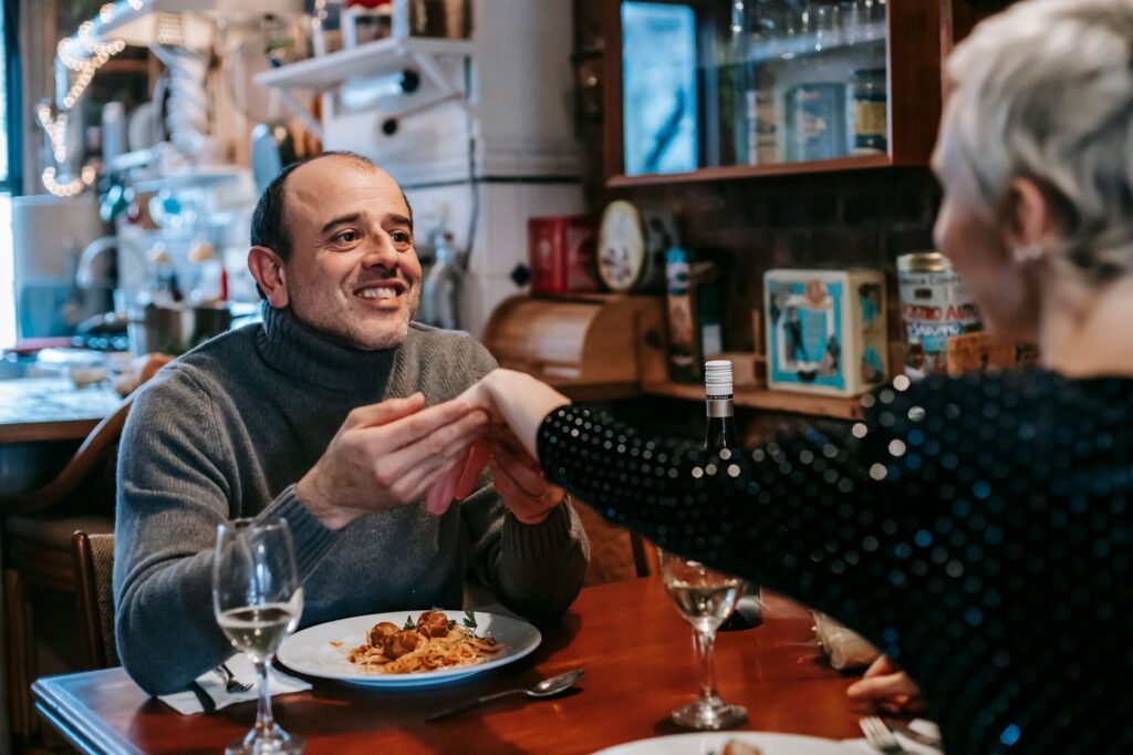 Two adults enjoying a relaxed dinner during a Sunderland weekend