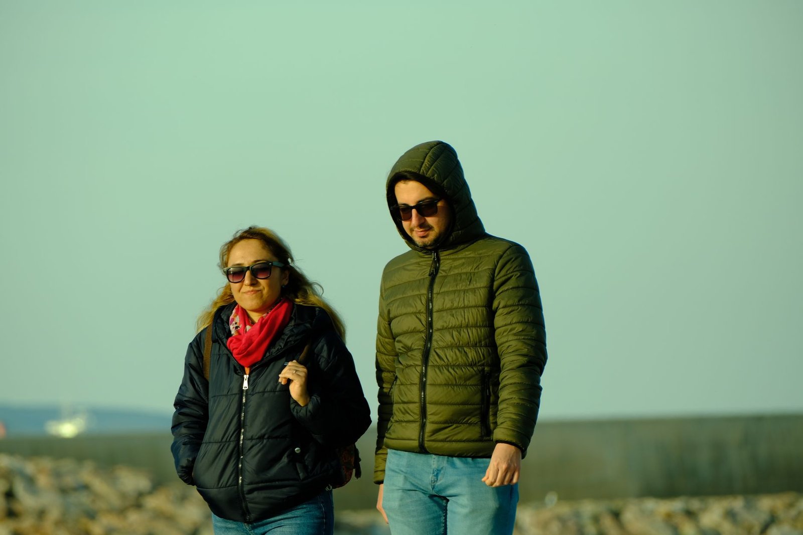 Two adults walking together along Sunderland seafront