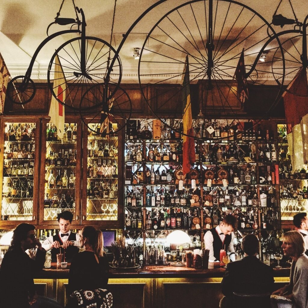 bar, wheel, drinks, beverages, liquor, store, alcohol, people, talking, men, brown talk, brown talking, bar, bar, bar, bar, b