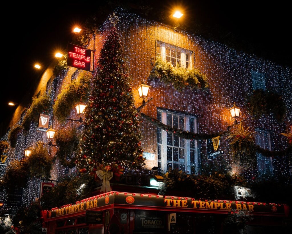 Illuminated Christmas lights at The Temple Bar in Dublin, Ireland, showcasing festive decorations.