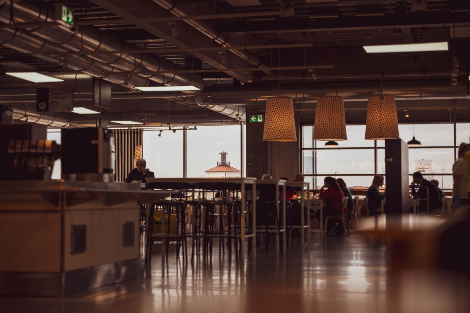 Cozy cafe interior with industrial design featuring dining area in Zagreb, Croatia.