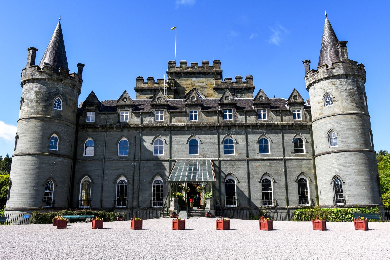 A stunning view of Inveraray Castle, a classic architectural landmark in Scotland's scenic landscape.