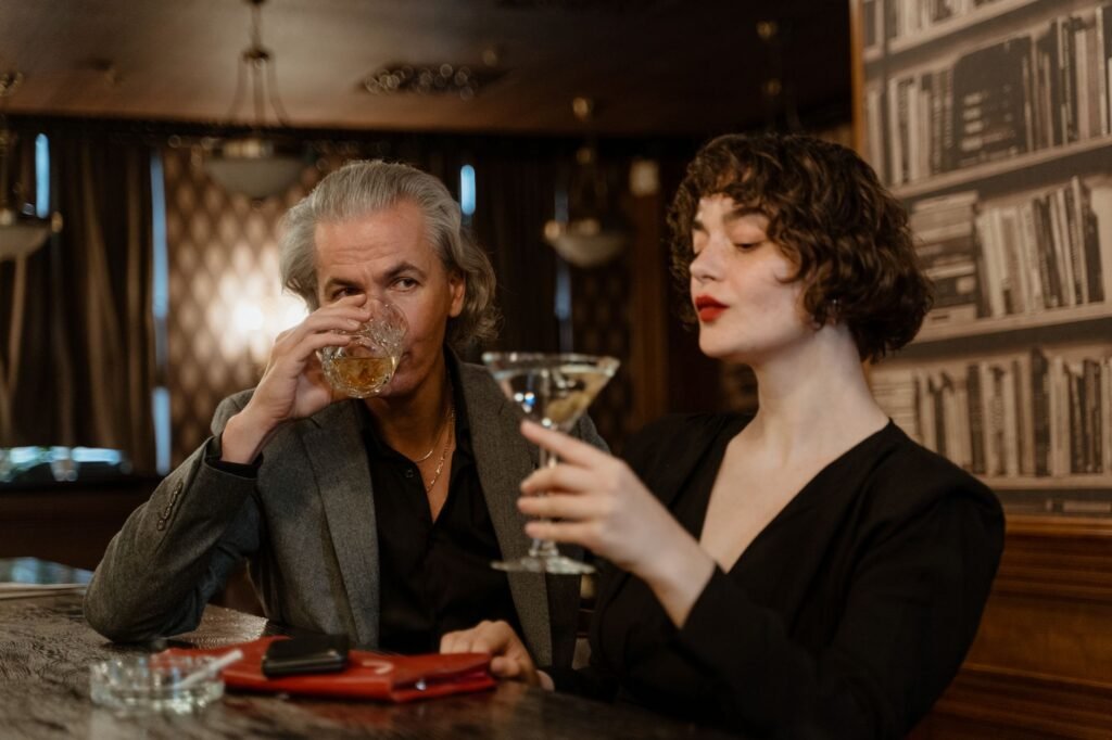Couple talking over drinks in a quiet evening setting