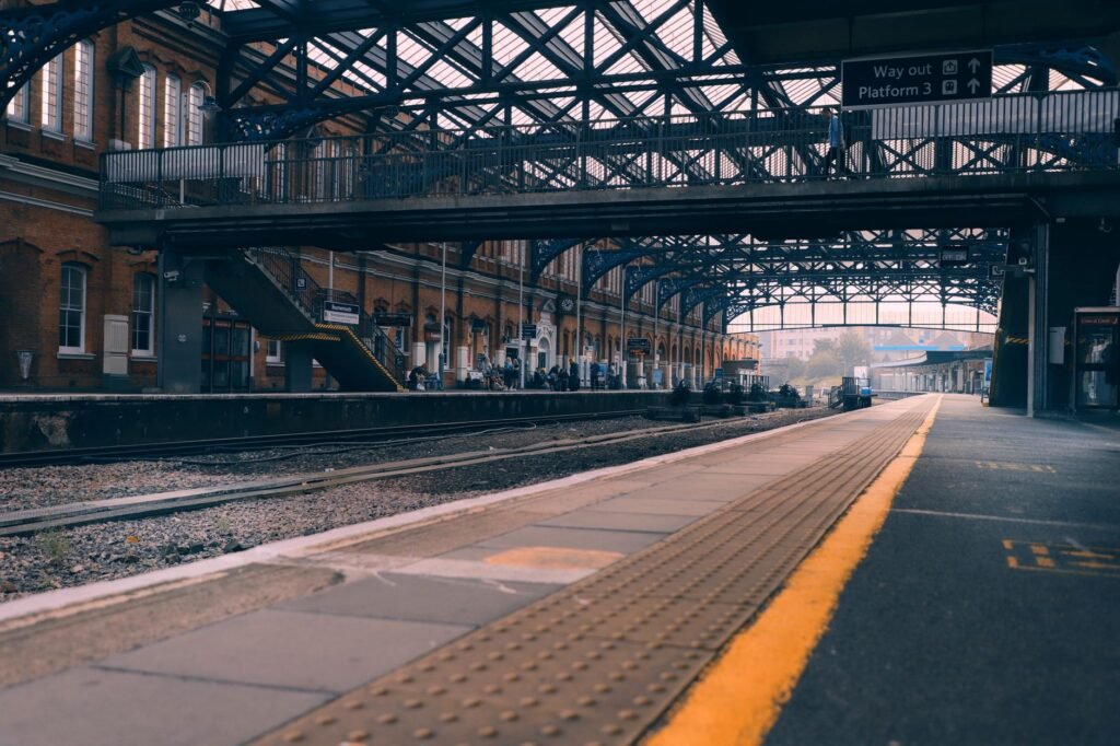 Bournemouth railway station showcasing its architecture and platforms in a tranquil early morning scene.