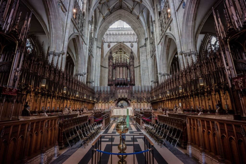 Explore the majestic Gothic architecture of York Minster's ornate choir, showcasing England's rich heritage.