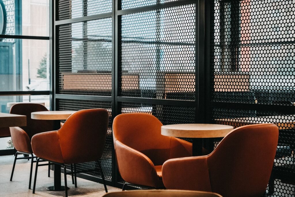 Elegant café interior in Istanbul featuring modern design with cozy chairs and tables.