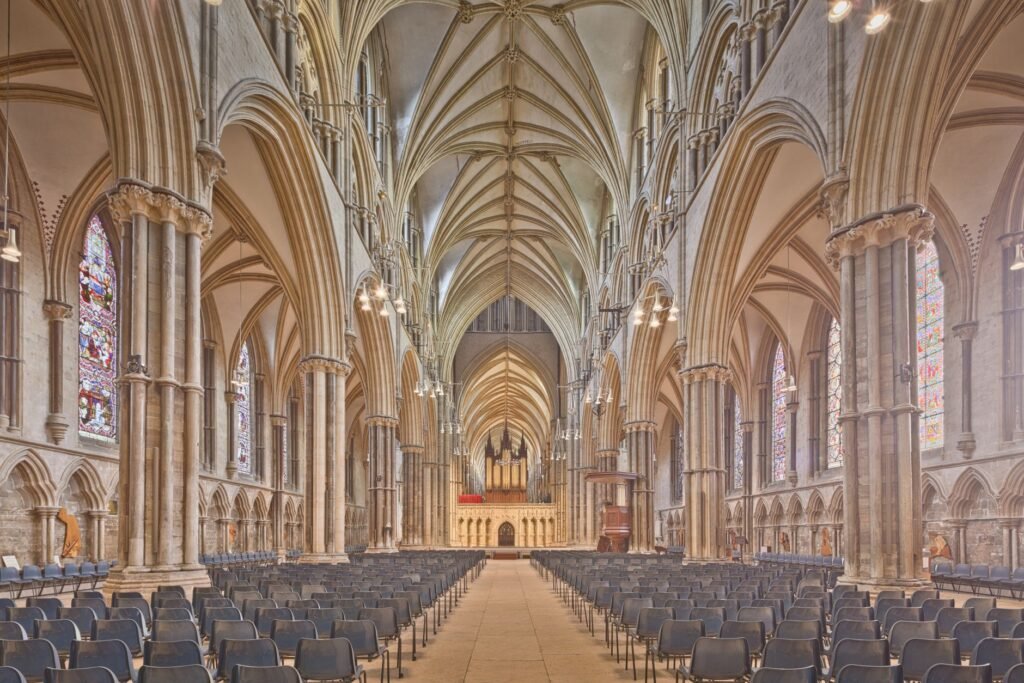 Explore the breathtaking gothic architecture of Lincoln Cathedral's nave in England's historic Lincolnshire.